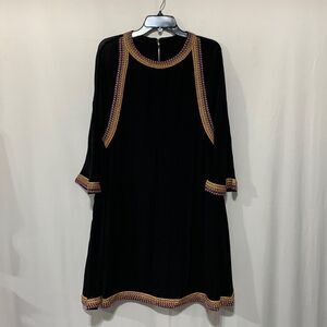 METISU dress accented by tribal trim w keyhole back button closure